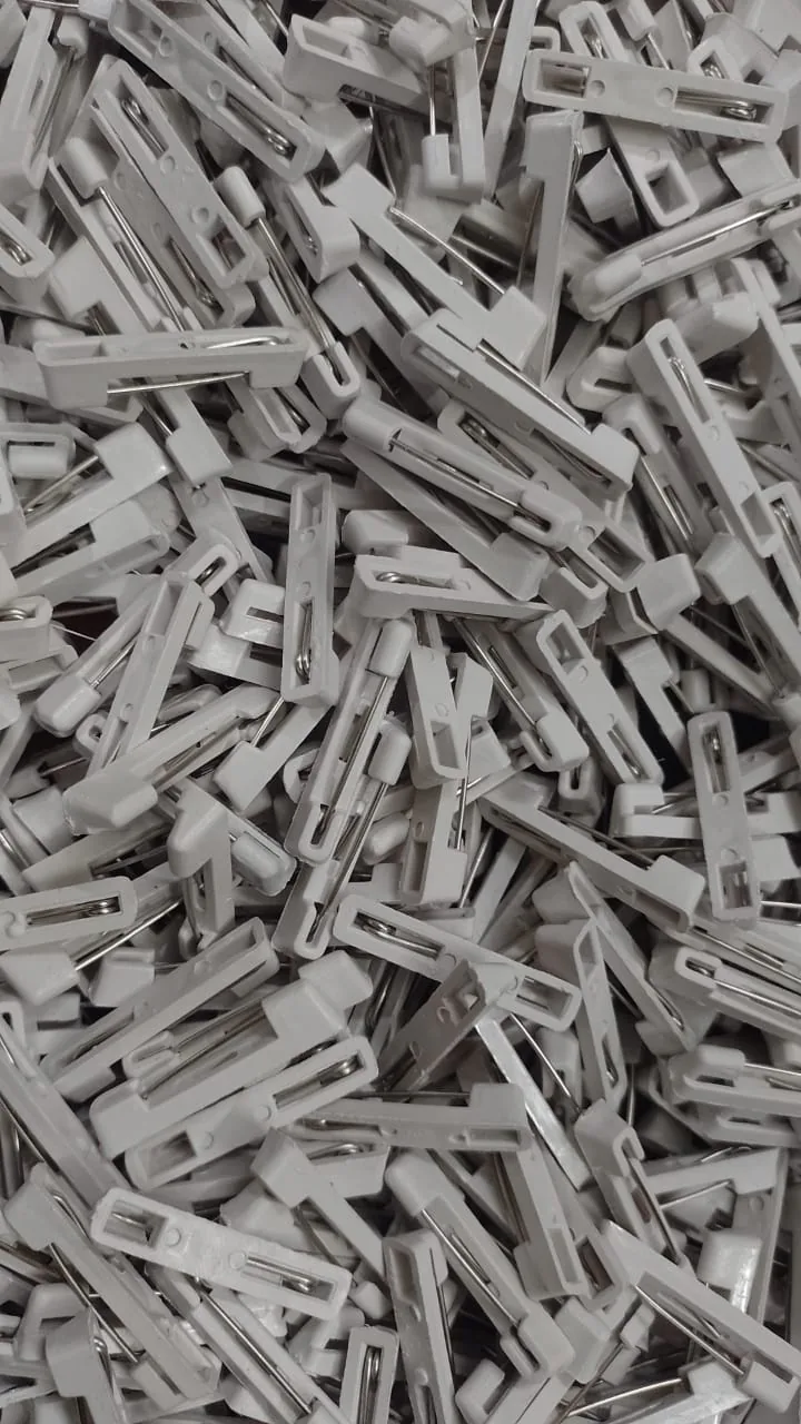 Plastic pin-back components used to manufacture Sidamhk button badges