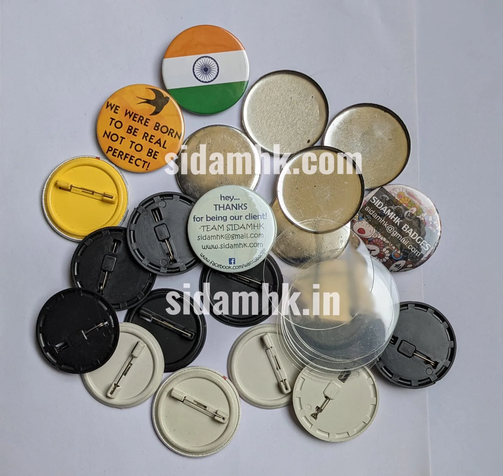Mixed metal shells, pin-backs, and badge components